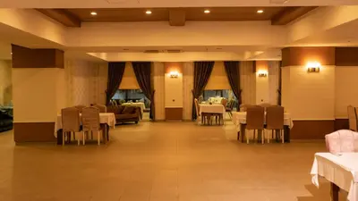 a restaurant with tables and chairs and a couch at MOX Hotel Wellness & Spa in Sapanca