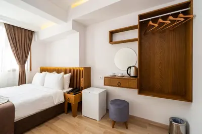 a hotel room with a bed and a mirror at Castillo Rojo Hotel Istanbul in Istanbul