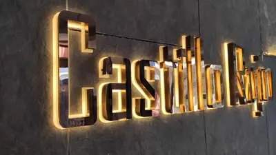 a neon sign that says the hotel on a wall at Castillo Rojo Hotel Istanbul in Istanbul