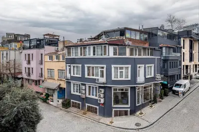 a large blue building on a city street at Bahaus Guest House Hostel Near Sultanahmet & Agia Sofia in Istanbul