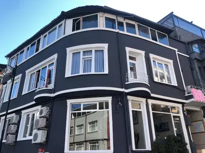 a large black building with white windows at Bahaus Guest House Hostel Near Sultanahmet & Agia Sofia in Istanbul