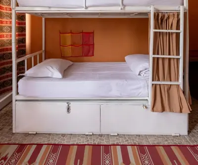 a bunk bed in a room with a white bunk bed at Bahaus Guest House Hostel Near Sultanahmet & Agia Sofia in Istanbul