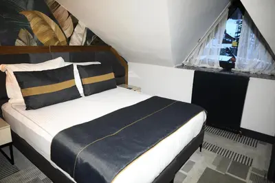 a bed in a small room with a window at Oksijen Zone Hotel & Spa - Full Board Plus in Uludag