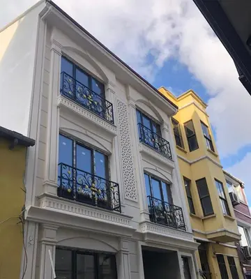 a white building with balconies on the side of it at Pege Hotel in Istanbul