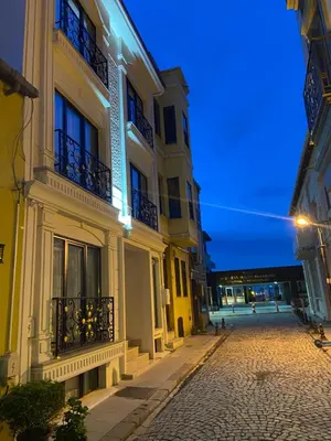 an empty street in a city at night at Pege Hotel in Istanbul