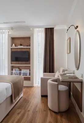 a hotel room with a bed and a living room at Delita City Hotel in Istanbul