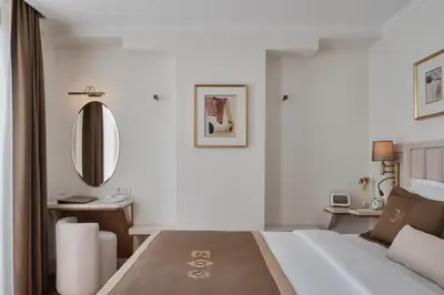 a hotel room with a bed and a mirror at Delita City Hotel in Istanbul