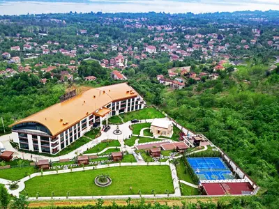 an aerial view of a building with a swimming pool at Cabir Deluxe Hotel Sapanca in Sapanca