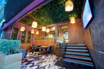 a restaurant with a table and chairs and lights at Dosso Dossi Hotels Laleli in Istanbul