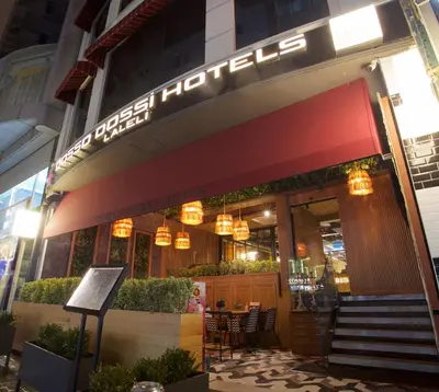 a restaurant with a sign on the front of it at Dosso Dossi Hotels Laleli in Istanbul