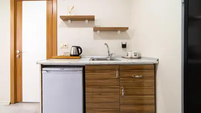 a kitchen with a sink and a counter top at Best Hotel Pendik in Istanbul
