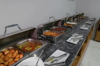 a buffet line with many trays of food at Sakarya Hotel in Sakarya