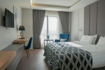 a hotel room with a bed and a window at Sakarya Hotel in Sakarya