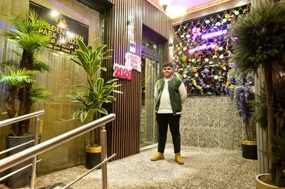 a man in a tie standing in a building at Golden Horn Park Hotel in Istanbul