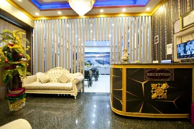 a living room with a couch and a christmas tree at Golden Horn Park Hotel in Istanbul
