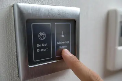 a person pressing a do not disturb button on a vehicle at Ravvda Hotel in Istanbul