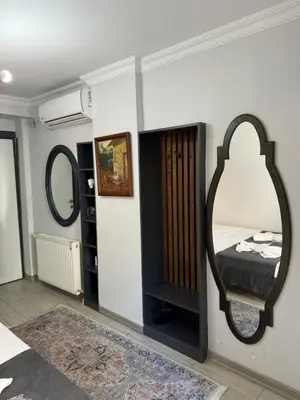 a bedroom with a large mirror and a bed at Valeria House in Istanbul