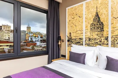 a bedroom with a window with a view of the city at The Halich Hotel Istanbul Karakoy - Special Category in Istanbul