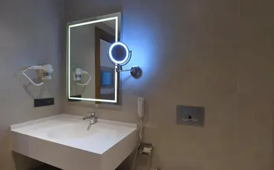 a bathroom with a white sink and a mirror at CHER HOTEL & SPA Taksim in Istanbul