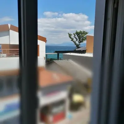 a view of the ocean from a window at Hotel Mudanya in Mudanya