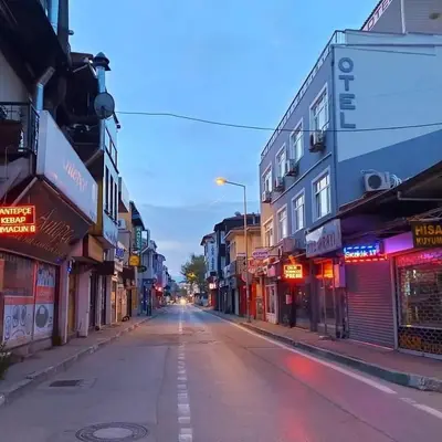 an empty street in a city with buildings at Hotel Mudanya in Mudanya
