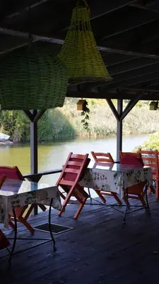 a group of chairs and a table on a dock at Treetops Park Hotel in Sile
