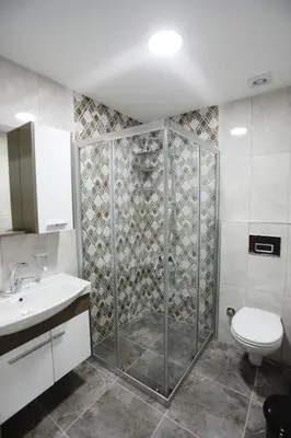 a bathroom with a shower and a toilet and a sink at Kubbe House in Istanbul