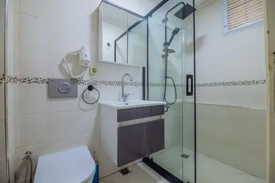 a bathroom with a shower and a sink and a toilet at Taksim Wonder Suites in Istanbul