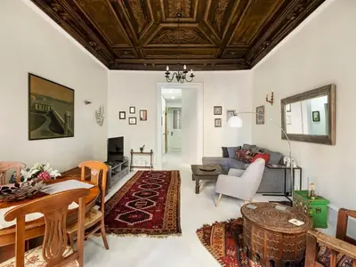 a living room with a wooden ceiling at High Ceiling Authentic Historic Ottoman Home! #49 in Istanbul