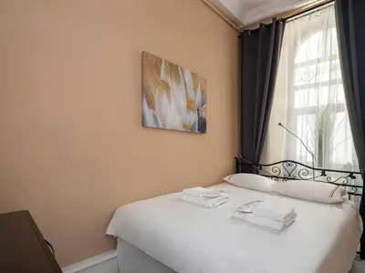 a bedroom with a bed with towels on it at High Ceiling Authentic Historic Ottoman Home! #49 in Istanbul