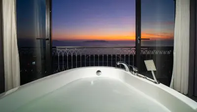 a bath tub in a room with a view at La Cielo Hotel Bostancı in Istanbul