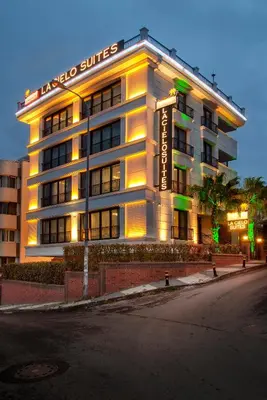 a hotel building with a sign that reads laoco suites at La Cielo Hotel Bostancı in Istanbul