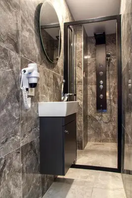 a bathroom with a sink and a shower at La Cielo Hotel Bostancı in Istanbul