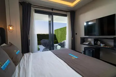 a hotel room with a bed and a sliding glass door at La Cielo Hotel Bostancı in Istanbul