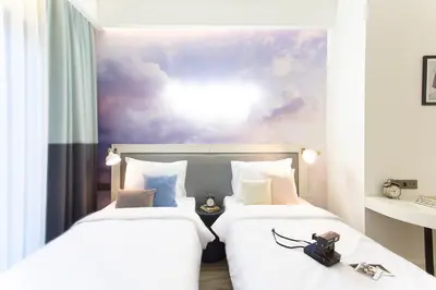 two beds sitting next to each other in a room at Anemon Bakırköy in Istanbul