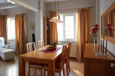 a kitchen and dining room with a table and chairs at Cozy Apartment Next to Taksim Square in Istanbul