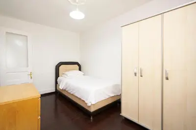 a bedroom with a bed and a large cabinet at Cozy Apartment Next to Taksim Square in Istanbul