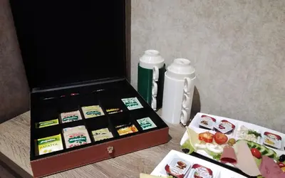 a box of food and a bottle of water on a table at Castle Franco Suites in Istanbul