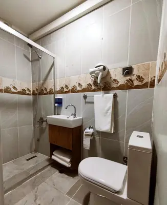 a bathroom with a toilet and a sink at Life Span Hotels in Istanbul