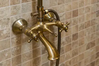 a brass shower faucet with a hose at Begonville Mansion Oldcity in Istanbul