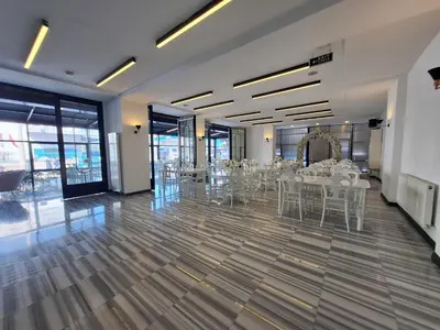 a banquet hall with white tables and chairs at N'Ala Otel in Sakarya