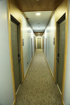 a corridor of a hallway with doors and a hallwayngth at Kerthill Hotel in Istanbul