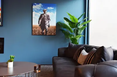 a living room with a couch and a picture on the wall at Kerthill Hotel in Istanbul