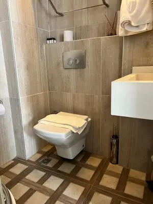 a bathroom with a toilet and a sink at Nacre Residence in Istanbul