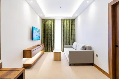 a living room with a couch and a window at Mardy Suit Hotel in Istanbul