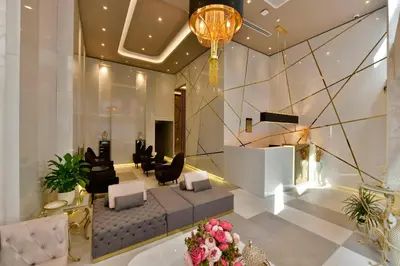 a lobby with a couch and chairs and a staircase at Ghan Hotel in Istanbul