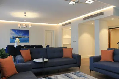 a living room with a couch and a table at Garlon Residence in Istanbul