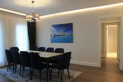 a dining room with a table and chairs at Garlon Residence in Istanbul