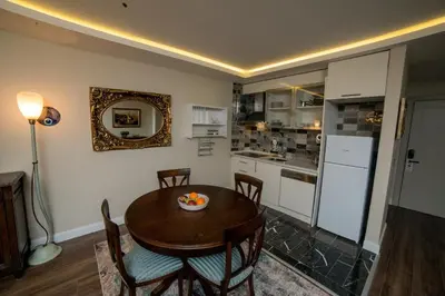 a kitchen and dining room with a table and chairs at The Charm Hotel - Old City in Istanbul
