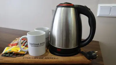 a coffee maker and two mugs on a table at ÜSKÜDAR OTEL in Istanbul